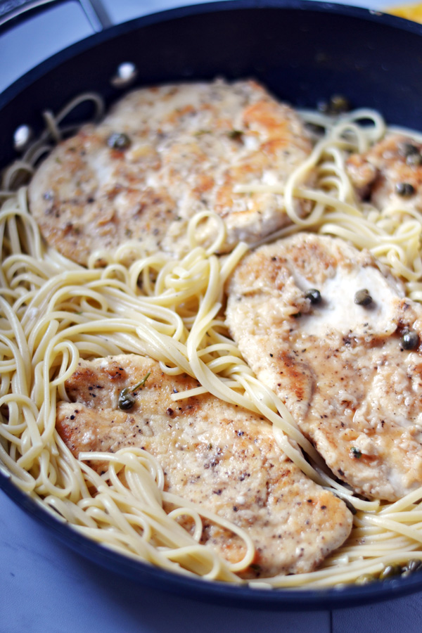 Nestled Lemon Chicken Piccata in linguine noodles.