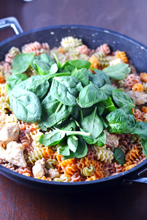 Fresh Spinach on top of Asiago Chicken Pasta