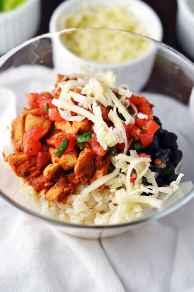 Layering the Chicken Burrito Bowls