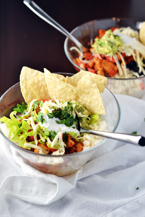 Chicken Burrito Bowls with tortilla chips for serving.